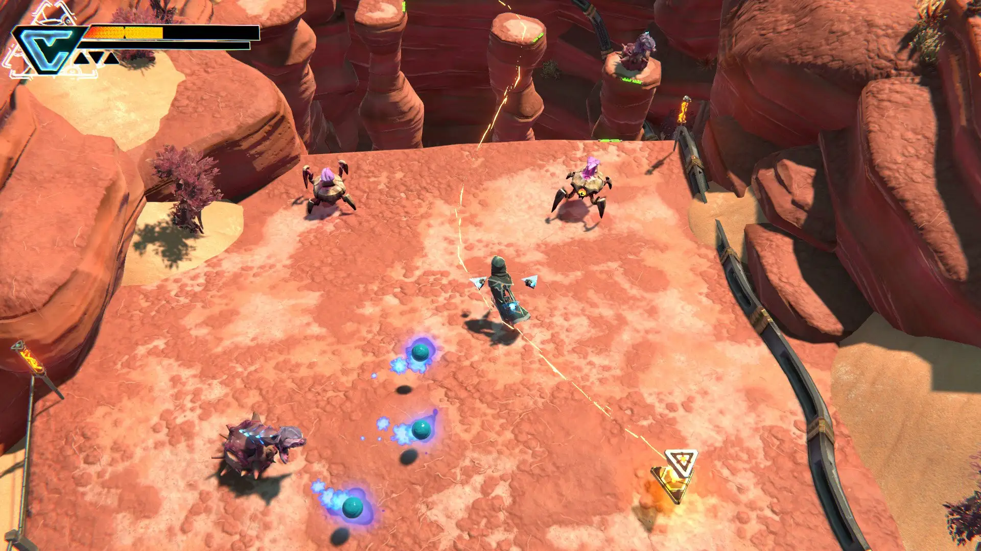 A hooded character faces robotic creatures in a red-rock canyon while blue projectiles cross the battlefield.