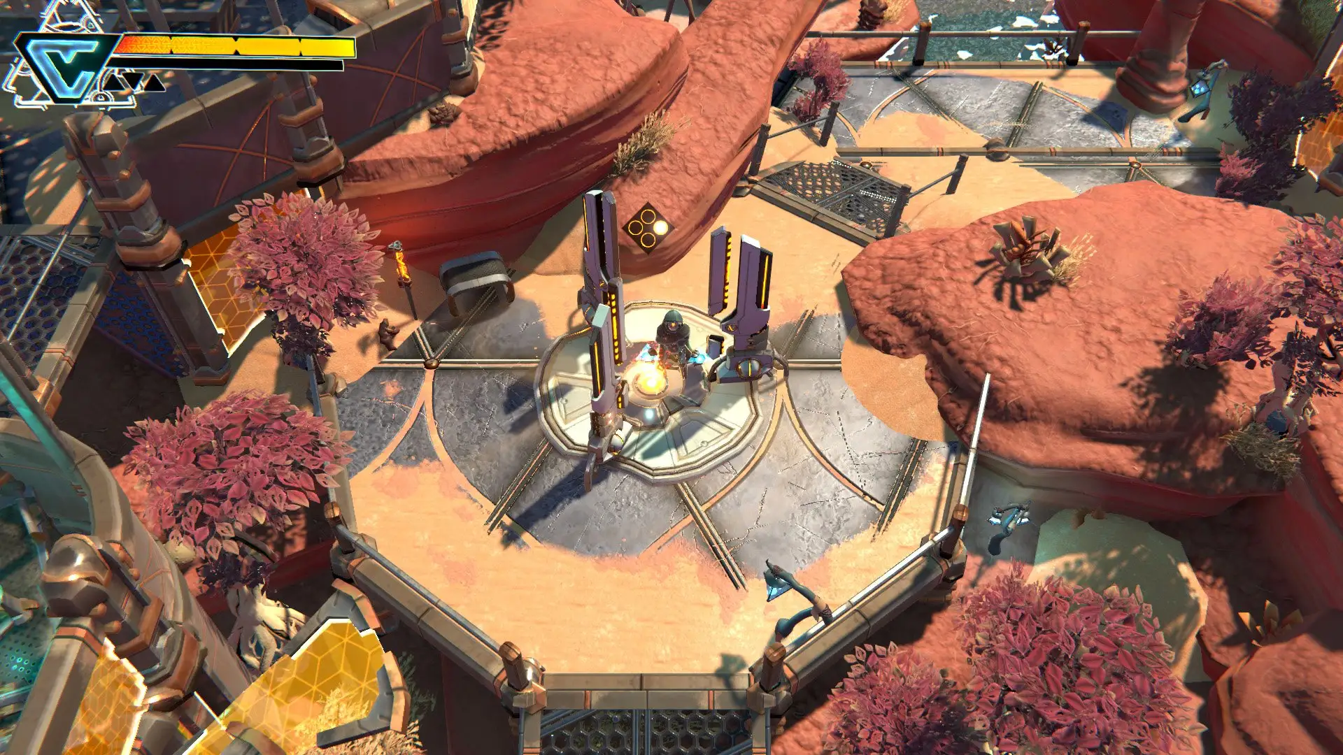An overhead view of a hooded character activating a circular mechanical platform among red-rock outcrops.